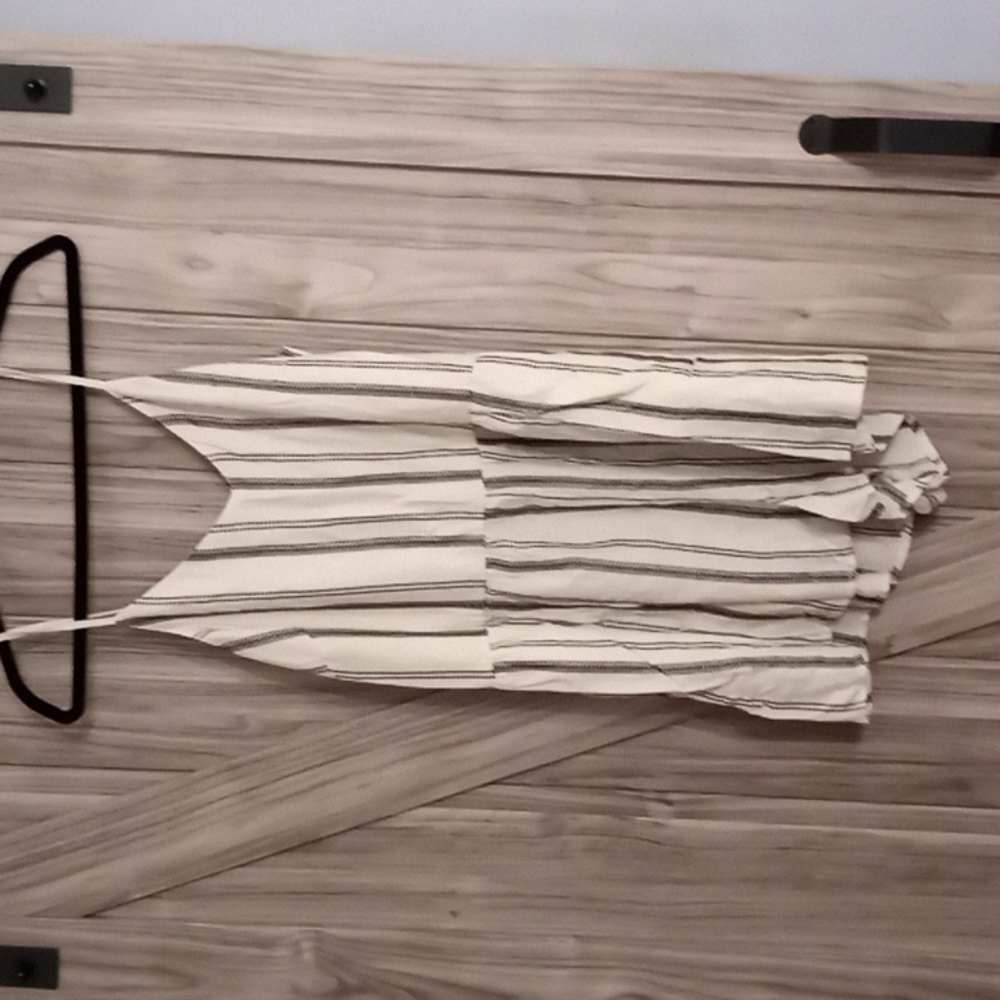 Cream colored romper with pockets